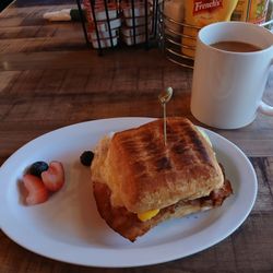 Mornin Sunshine Coffee House & Catering - "Build your own" breakfast sandwich.  Ham, egg. Swiss cheese on a croissant toasted on panini press!