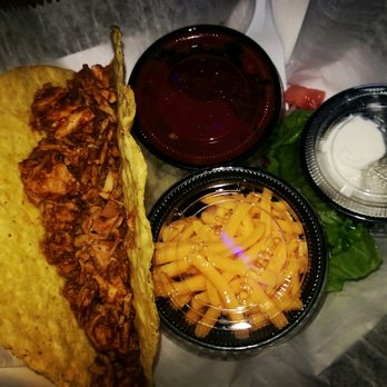 Uncle Mick's Bar & Grill - $1 taco, lot of fresh salad and onions underneath the containers. Huge. Excellent tomato sauce. Unbeatable deal!!!! - American Near Me - Jupiter, Florida