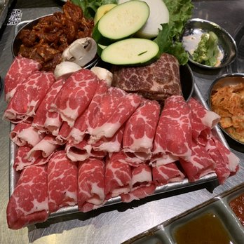 Tomukun Korean Barbeque - Combo 1 clockwise from top left: Dweji Bulgogi (Spicy Pork), Yangnyum Galbi (Marinated Short Ribs), Chadulbaegi (Beef Brisket) - Korean Near Me - Ann Arbor, Michigan Tomukun Korean Barbeque - Combo 1 clockwise from top left: Dweji Bulgogi (Spicy Pork), Yangnyum Galbi (Marinated Short Ribs), Chadulbaegi (Beef Brisket) - Korean Near Me - Ann Arbor, Michigan