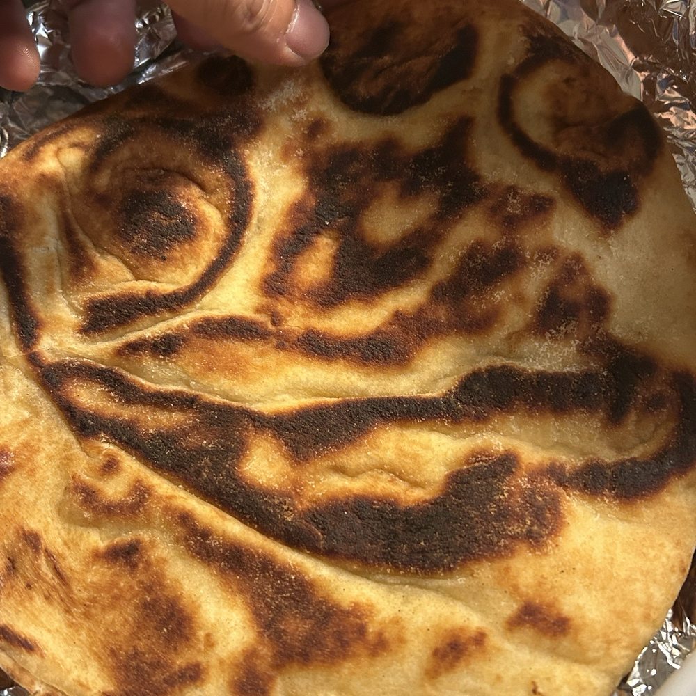 Burned pita Bread it's a shame to call naan Burned pita Bread it's a shame to call naan