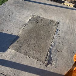 Twisted Lawn Care - The concrete patch work after they fudged a fire pit and had to remove it.