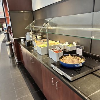 United Polaris Lounge - a buffet of food - Airport Lounges Near Me - Houston, Texas
