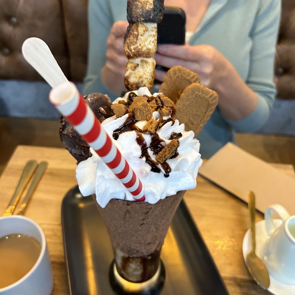 Craffles - a woman taking a picture of a dessert - Waffles Near Me - Vancouver, British Columbia Craffles - a woman taking a picture of a dessert - Waffles Near Me - Vancouver, British Columbia