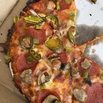 Big John's Pizza - a half eaten pizza - Pizza Near Me - Whitehall, Michigan