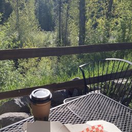 Savory roll and coffee on the back patio looking towards a section of the river.