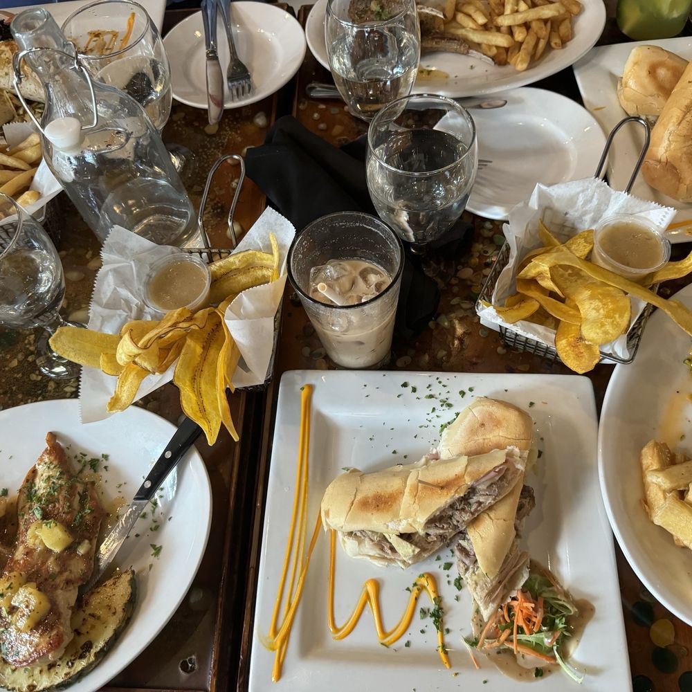 Bella Cuba - Dishes and sides (Plantain Chips, Yuca Fries with Garlic Lime Mojo, Fries) Iced Cafe con Leche - Cuban Near Me - Miami Beach, Florida Bella Cuba - Dishes and sides (Plantain Chips, Yuca Fries with Garlic Lime Mojo, Fries) Iced Cafe con Leche - Cuban Near Me - Miami Beach, Florida