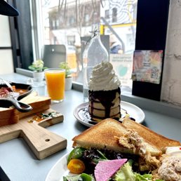 a plate of food and a glass of orange juice a plate of food and a glass of orange juice