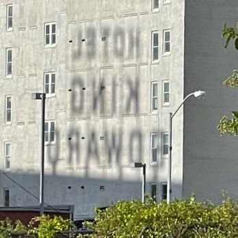 Hilton Garden Inn Jackson Downtown - Shadow of the giant rooftop hotel king Edward signage reflecting off of an adjacent Downtown Jackson building. - Hotels Near Me - Jackson, Mississippi