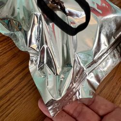 Enjoyacorn - Slice in back of bag I received.