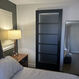 Closet door closed with black hardware handle