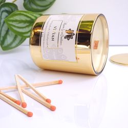 Kravn Lane Creations - "VIVIAN" 8oz candle handpoured in a lustrous gold glass vessel, paired with artisan safety matches - a design to compliment any space!