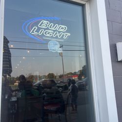 Cheap Seats Sports Bar & Grille - Window and sign