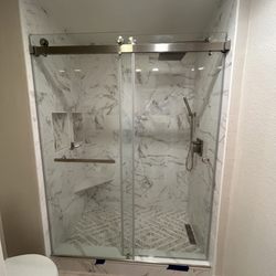 View Window & Mirror Home Repair - Frameless sliding shower door.