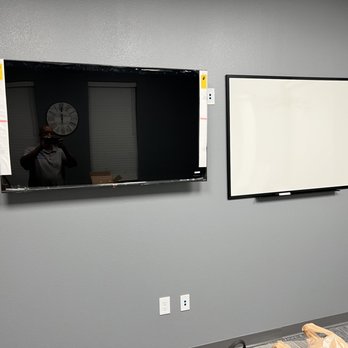 Steady Flow Hanging & Mounting - Tv next to dry erase board - TV Mounting Near Me Steady Flow Hanging & Mounting - Tv next to dry erase board - TV Mounting Near Me