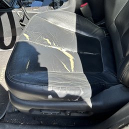 Before photo of torn leather driver seat