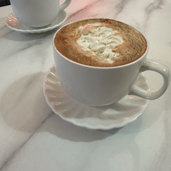 One Love Cafe - Horchata Latte with light whip in front Pumpkin Spiced Latte with whip in back - Coffee & Tea Near Me - San Bruno, California One Love Cafe - Horchata Latte with light whip in front Pumpkin Spiced Latte with whip in back - Coffee & Tea Near Me - San Bruno, California