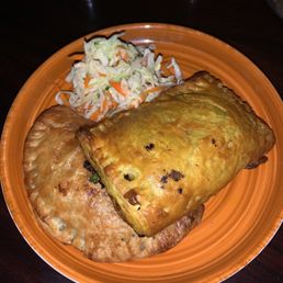 Baked Kale & Mushroom Empanada (bottom left) and Jamaican Beef Empanada Baked Kale & Mushroom Empanada (bottom left) and Jamaican Beef Empanada