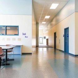 Wings Learning Center - The cafeteria and hallways of the inside of the school.