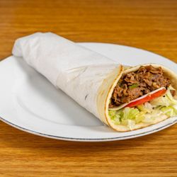 Hoolie's Grill - Loaded with tender Philly steak, crisp lettuce, and fresh tomato, this wrap is a flavor-packed delight!
