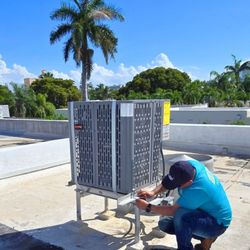 Bora HVAC - Rooftop condenser installation in Miami Beach.