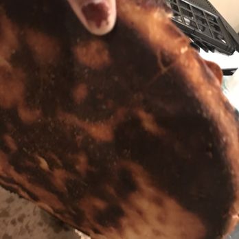 Domino's Pizza - a person holding a piece of pizza - Pizza Near Me - Hemet, California