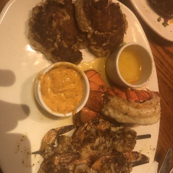 Outback Steakhouse - Oh now this is a freaking treat. Butter drenched plate. Lobster the size of a large crawfish. Over cooked. Over salted. Nastyness! - Steakhouses Near Me - Lafayette, Louisiana