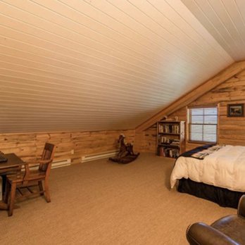 Filener Construction - a bedroom in a log home - General Contractors Near Me - Cody, Wyoming Filener Construction - a bedroom in a log home - General Contractors Near Me - Cody, Wyoming