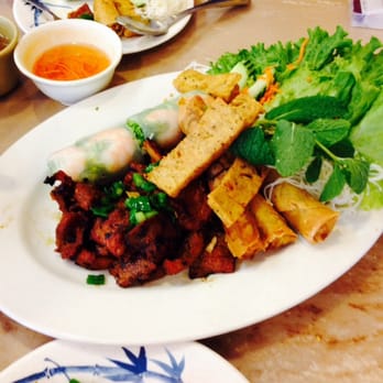 Pho Island - #1 appetizer plate. BBQ pork, fried fish cakes, spring rolls, peanut sauce, egg rolls, salad, noodles, and one other item. - Vietnamese Near Me - Chino, California Pho Island - #1 appetizer plate. BBQ pork, fried fish cakes, spring rolls, peanut sauce, egg rolls, salad, noodles, and one other item. - Vietnamese Near Me - Chino, California