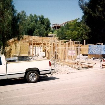 Helfman Construction - a truck parked in front of a house under construction - General Contractors Near Me - Morongo Valley, California