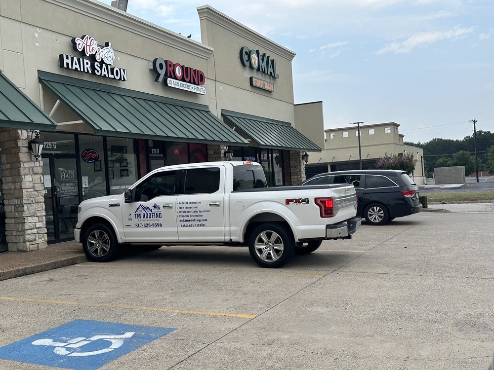 Slide of TM Roofing & Construction Group