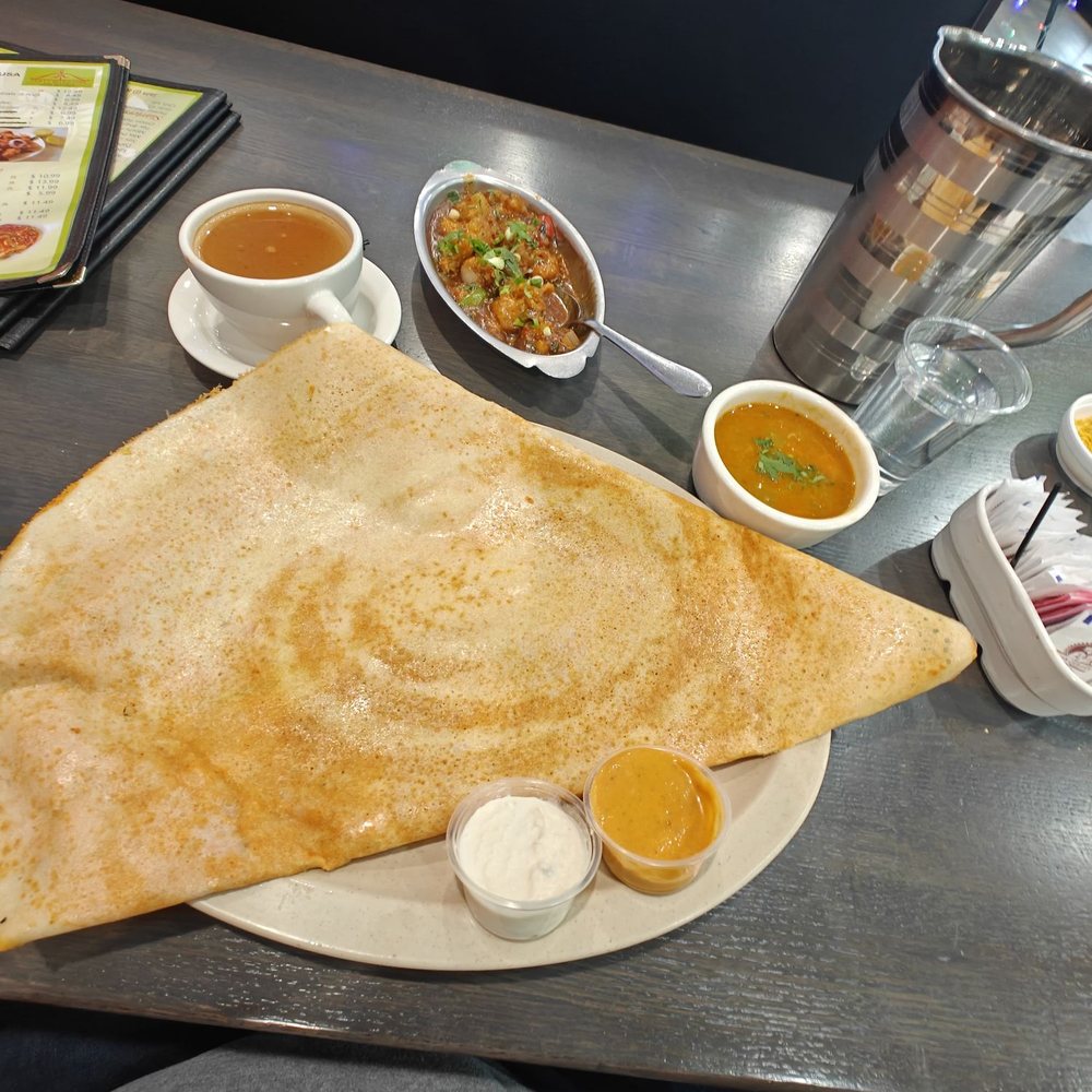 Tasty Bites Usa - Ghee dosa in front, gobi (cauliflower) manchurian w/ gravy next to the chai. - Indian Near Me - Schaumburg, Illinois Tasty Bites Usa - Ghee dosa in front, gobi (cauliflower) manchurian w/ gravy next to the chai. - Indian Near Me - Schaumburg, Illinois