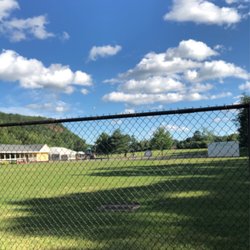 Mountain Mist Outdoor Center - View of the field and cabin/tent