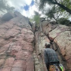 Devils Lake Climbing Guides - Our guide, Mark, and my 69-year-old dad (up on the wall)!