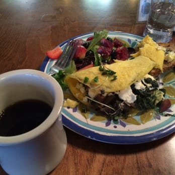 Juicy Kitchen - Omelette with beets, purple potatoes, spinach, caramelized onions, goat cheese; with multigrain toast, fruits & greens, & Mighty Good coffee - Breakfast & Brunch Near Me - Ann Arbor, Michigan Juicy Kitchen - Omelette with beets, purple potatoes, spinach, caramelized onions, goat cheese; with multigrain toast, fruits & greens, & Mighty Good coffee - Breakfast & Brunch Near Me - Ann Arbor, Michigan