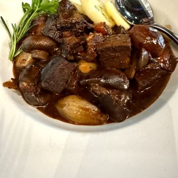 Laperaux Bistro - Boeuf Bourguignon red wine braised beef in veal jus with mushroom, carrot and parslied potatoes - French Near Me - Germantown, Maryland Laperaux Bistro - Boeuf Bourguignon red wine braised beef in veal jus with mushroom, carrot and parslied potatoes - French Near Me - Germantown, Maryland