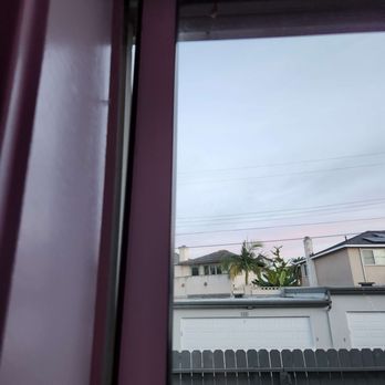 The REMM Group - Sliding glass window hanging off the frame. - Property Management Near Me - Santa Ana, California