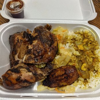 Island Vibes Caribbean Grill - Jerk chicken with white rice. Curry gravy on the rice. Congress with cabbage and plantain. - Caribbean Near Me - Atlanta, Georgia