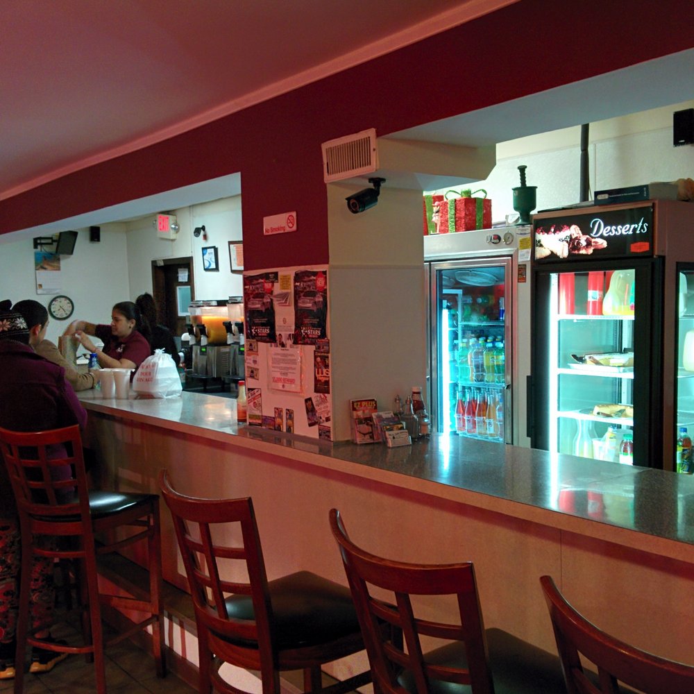 Freddy's Restaurant - a bar with people sitting at it - Spanish Near Me - Camden, New Jersey Freddy's Restaurant - a bar with people sitting at it - Spanish Near Me - Camden, New Jersey