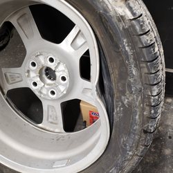 Pep Boys - The badly bashed front right wheel.