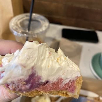Bibble & Sip - Inside of Raspberry Lychee tart. The darker pink on the left is actually almost a whole piece of lychee. - Coffee & Tea Near Me - New York, New York