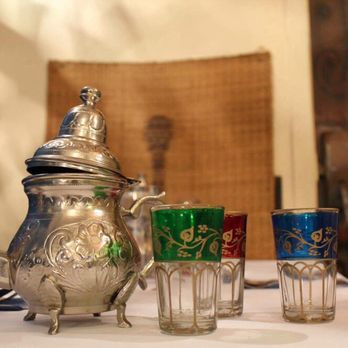 Les Deux Oliviers - a silver teapot and glasses on a table - Mediterranean Near Me - Montreal, Quebec Les Deux Oliviers - a silver teapot and glasses on a table - Mediterranean Near Me - Montreal, Quebec
