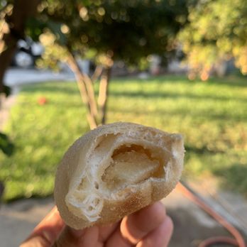 Bella's Bakery - a hand holding a half eaten pastry - Bakeries Near Me - Lathrop, California Bella's Bakery - a hand holding a half eaten pastry - Bakeries Near Me - Lathrop, California