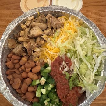 Outlaw’s Roost - Chicken bowl w rice, pinto beans, lettuce, Monterey cheese, mild salsa, jalapeños, chipotle sauce, and sour cream - Mexican Near Me - Hanksville, Utah Outlaw’s Roost - Chicken bowl w rice, pinto beans, lettuce, Monterey cheese, mild salsa, jalapeños, chipotle sauce, and sour cream - Mexican Near Me - Hanksville, Utah