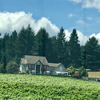Five Fourteen Vineyards - a house on a hill with trees in the background - Wine Tasting Room Near Me - Junction City, Oregon Five Fourteen Vineyards - a house on a hill with trees in the background - Wine Tasting Room Near Me - Junction City, Oregon