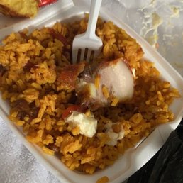 a plate of food with rice and meat