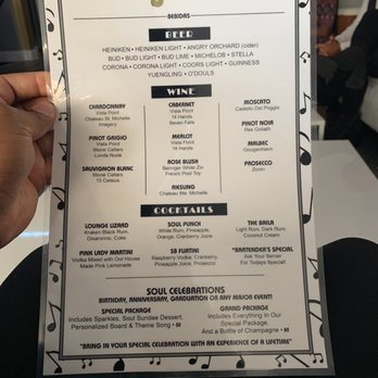 Soulbaila - a person holding up a menu - Southern Near Me - Hartford, Connecticut Soulbaila - a person holding up a menu - Southern Near Me - Hartford, Connecticut
