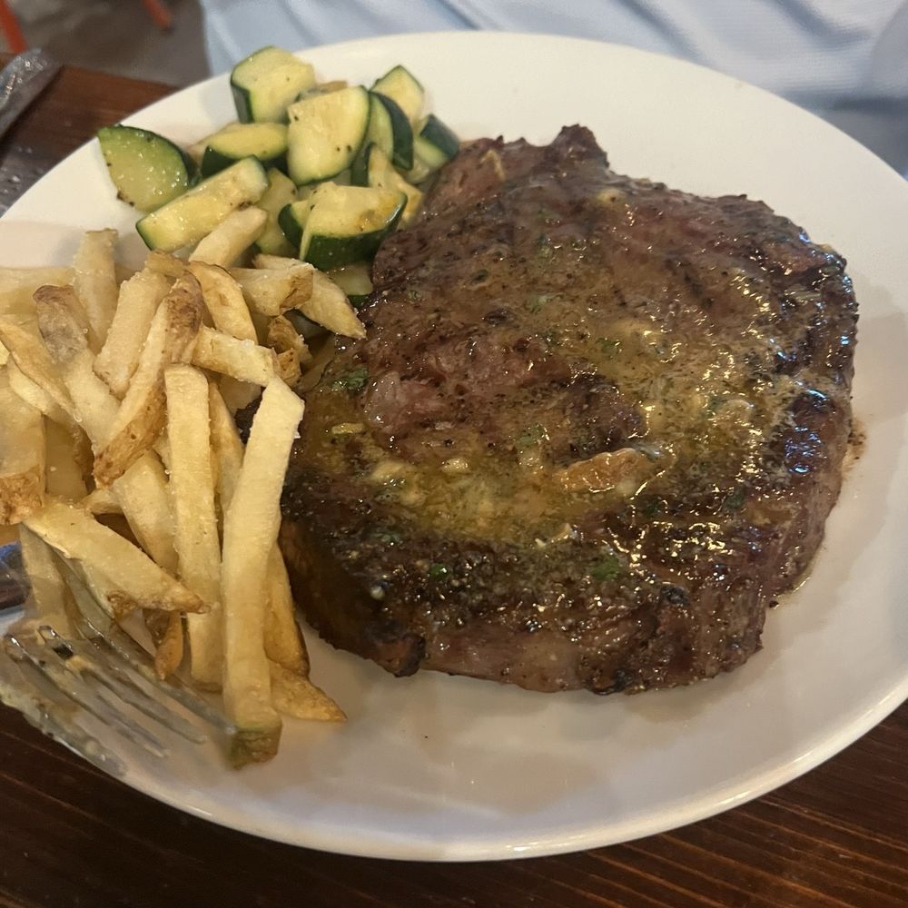 Savanna - Ribeye steak. French fries and zuchini. - Seafood Near Me - Gulf Shores, Alabama Savanna - Ribeye steak. French fries and zuchini. - Seafood Near Me - Gulf Shores, Alabama