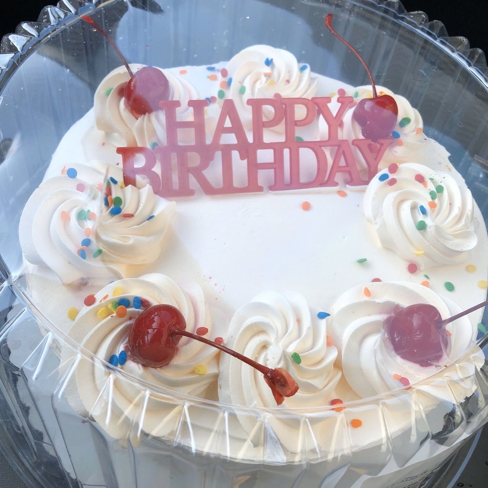 a birthday cake in a plastic container a birthday cake in a plastic container