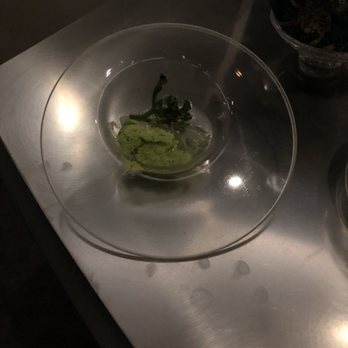 Alinea - One of my favorites - the palate cleanser. Rambutan, distillation of horseradish mint powder, aurora blue soccolet(sp?) leaf. Amazing! - New American Near Me - Chicago, Illinois