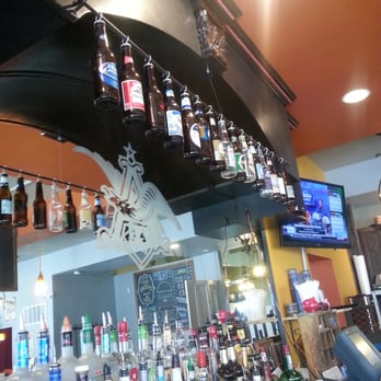 Stacked STL - they hang the bottled beer selection from a curtain rod behind the bar! - Burgers Near Me - Saint Louis, Missouri Stacked STL - they hang the bottled beer selection from a curtain rod behind the bar! - Burgers Near Me - Saint Louis, Missouri